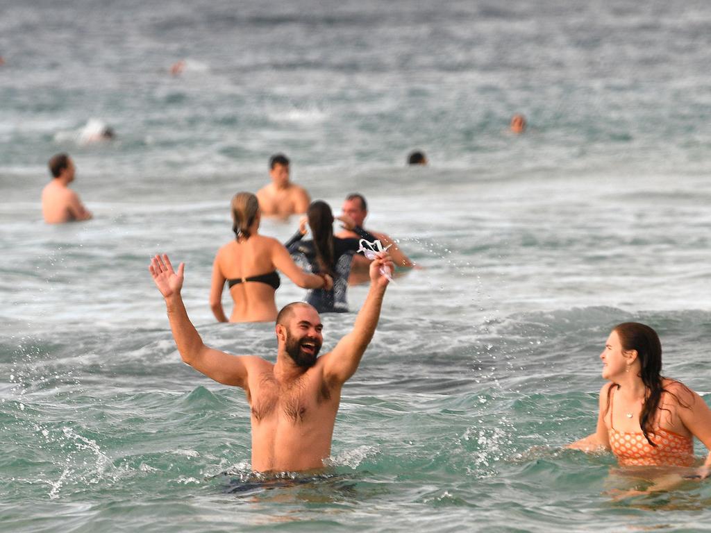 Beachgoers enjoy their first swim after Bondi Beach reopened following a five week closure. Picture: AFP