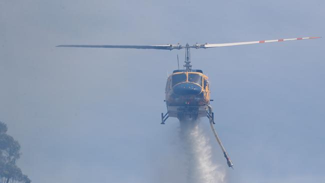 Helicopter dumping water. Bushfire in Dynnyrne threatening homes. Picture: Nikki Davis-Jones