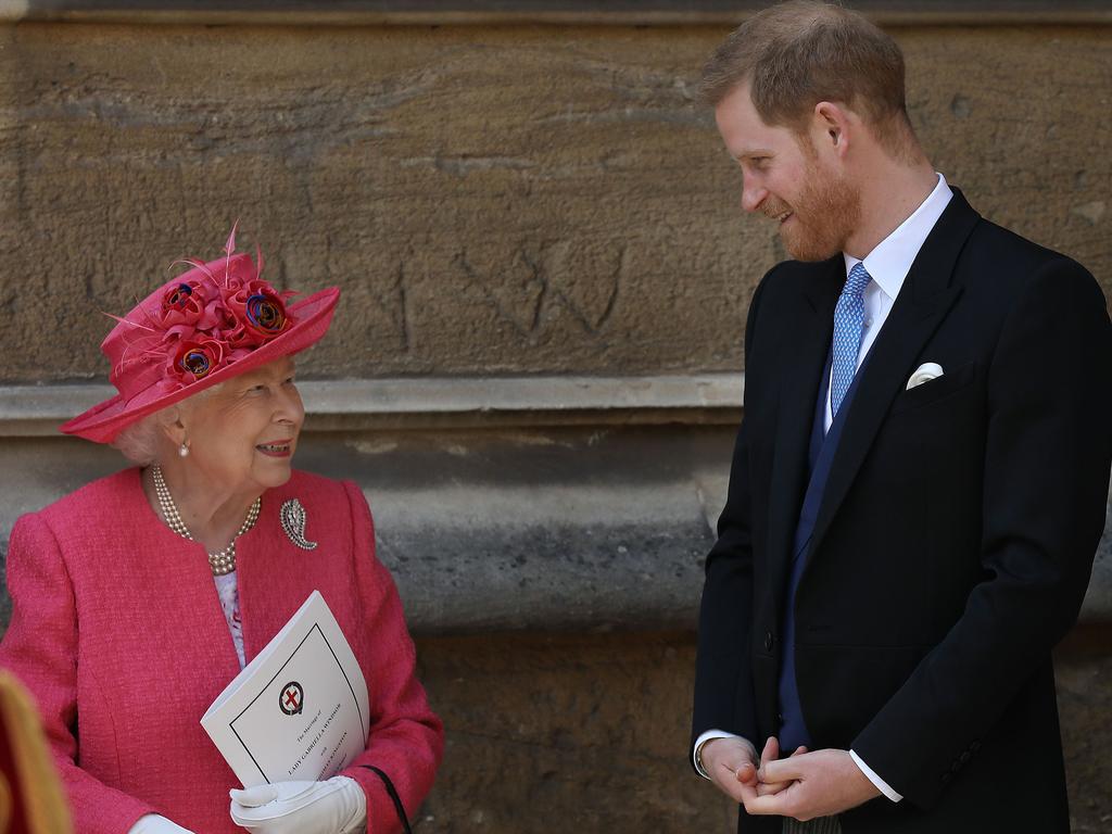 Britain's Queen Elizabeth II chats to Britain's Prince Harry, Duke of Sussex as they leave St George's Chapel in Windsor Castle. Picture: AFP