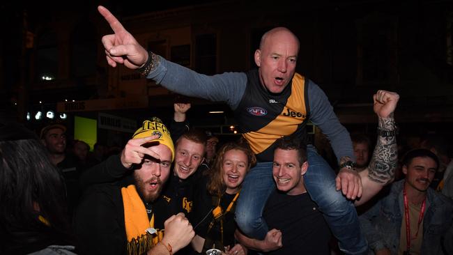 Tigers supporters celebrating the Richmond flag on Swan Street in 2017. Will we see a repeat on this next week? Picture: AAP Image, James Ross.