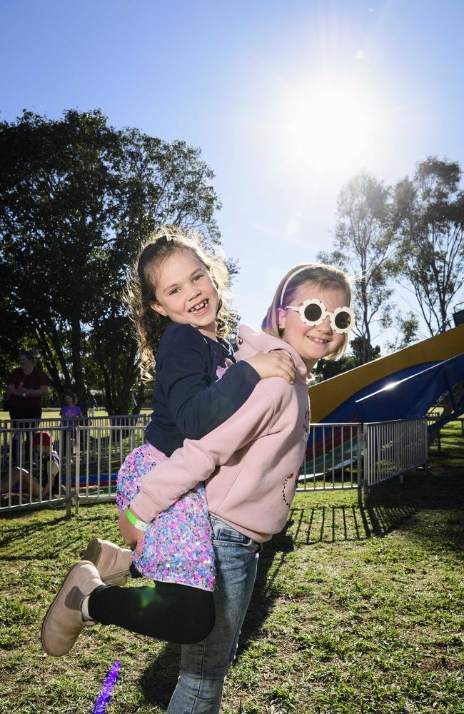 Maisey Death gets a ride on Payten Belford at Sadie's Day Out, a special community event to celebrate the life of five-year-old crash victim Sadie, held at Cambooya State School, Saturday, June 7, 2025. Picture: Kevin Farmer