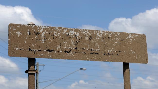 Mud dries over a Rocklea sign in the Brisbane suburb of Rocklea on Monday, January 17, 2011.