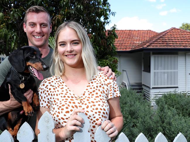 Russell and Larissa Duplock with their dog Kevin at their recently purchased investment home in Stafford Heights. Photographer: Liam Kidston