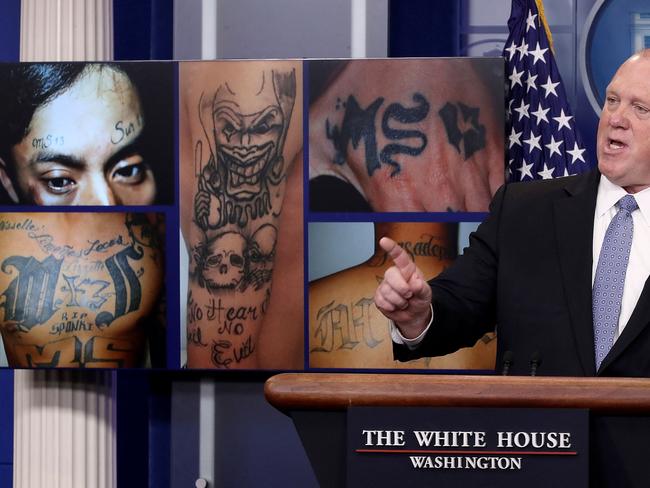 Tom Homan, Director of Immigration and Customs Enforcement, answers questions in front of gang related photos from the MS-13 gang during a daily briefing at the White House July 27, 2017 in Washington, DC. Picture: AFP