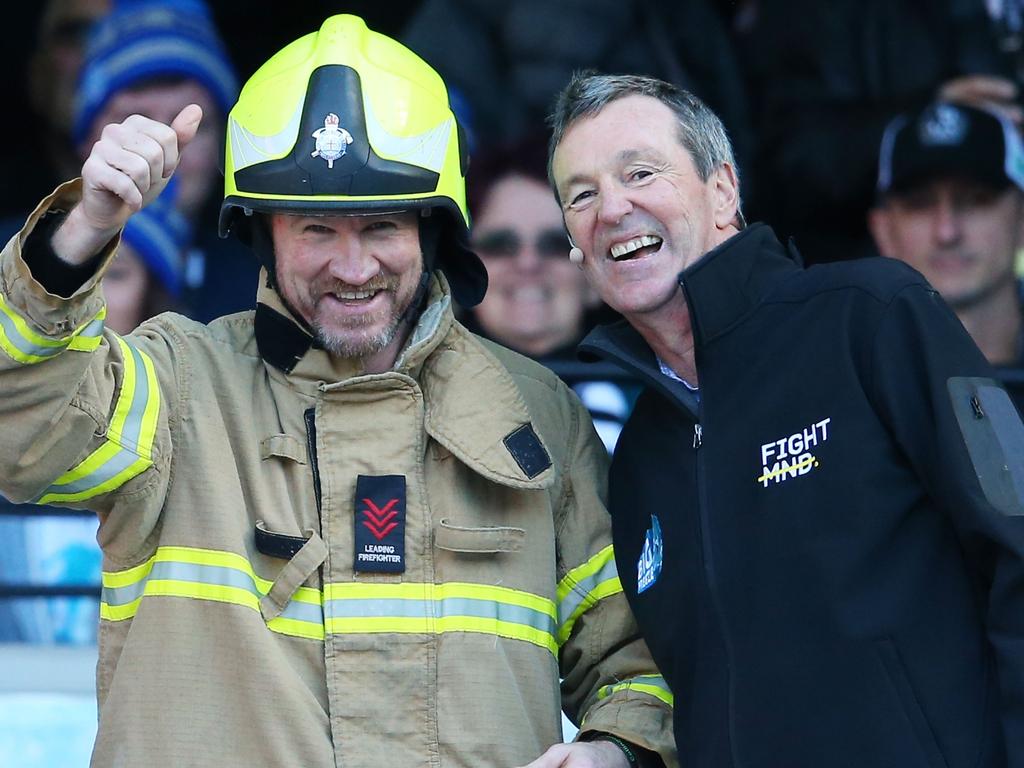 Nathan Buckley with Neale Daniher before heading down the Big Freeze slide. Picture: Scott Barbour/AFL Media