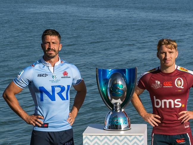 Waratahs skipper Jake Gordon (left) and Reds co-captain Tate McDermott will go head-to-head on Saturday night. Picture: Dave Rowland/Getty Images for Rugby Australia