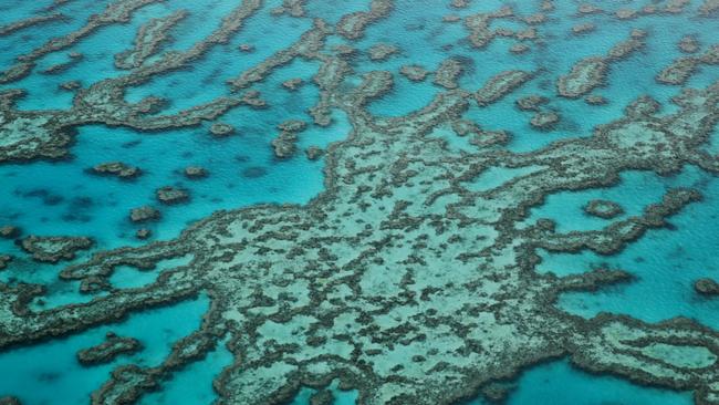 Aerial image of the outer Great Barrier Reef off the Whitsundays. Picture: Lachie Millard