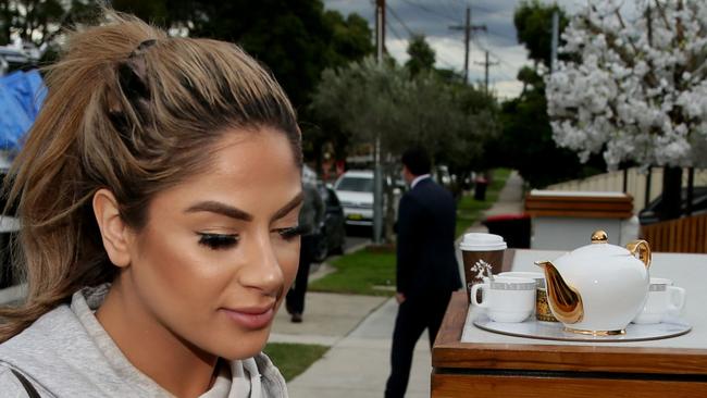 One of Salim Mehajer's sisters arrives at his property in Lidcombe and offers waiting media a pot of tea.