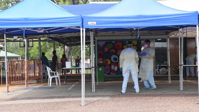 Staff rotate in 30 minute shifts at Katherine East testing clinic as temperatures and humidity climb. Picture: Amanda Parkinson