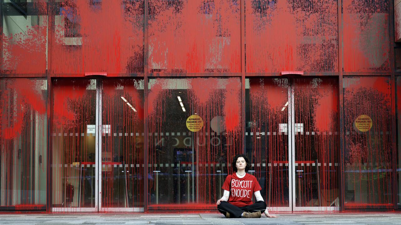 A protester sits at vandalised UK government offices in Edinburgh, demonstrating against Britain’s stance on the Gaza conflict. Picture: Jeff J Mitchell/Getty Images