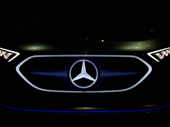 (FILES) In this file photo taken on April 05, 2018 a Mercedes logo appears on a EQA electric concept car during German luxury car manufacturer Daimler's annual general meeting in Berlin. - German luxury carmaker Daimler said on July 22, 2021 it was investing 40 billion euros (USD 47 billion) in a full shift to electric Mercedes-Benz vehicles by the end of the decade. "Mercedes-Benz will be ready to go all-electric within this decade," the firm said, adding it would have an electric version of all models by 2025 and would open eight battery production facilities to enable the transition. (Photo by John MACDOUGALL / AFP)