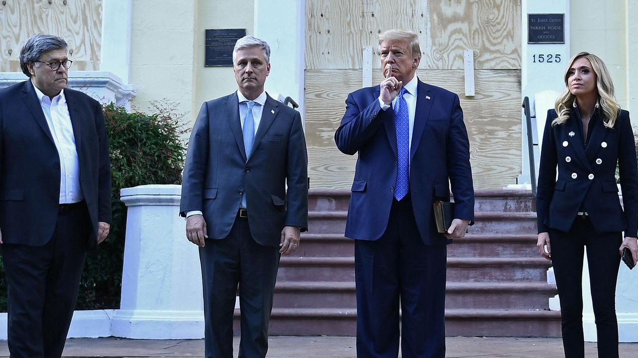 Donald Trump alongside former US Attorney-General William Barr, White House Chief of Staff Mark Meadows and White House press secretary Kayleigh McEnany. Picture: Brendan Smialowski/AFP