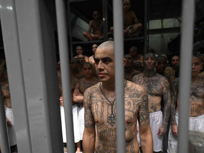 Inmates look on as they remain in a cell at the Counter-Terrorism Confinement Centre in El Salvador. Picture: AFP