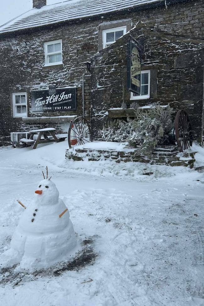 Mr Wright made a snowman to pass the time. Picture: Paul Wright