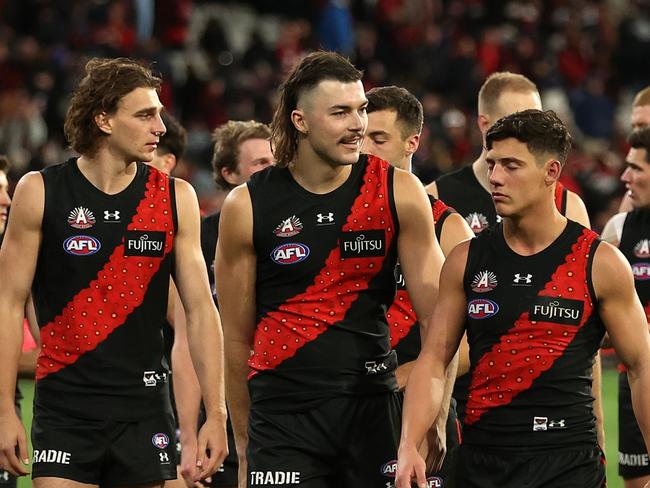 MELBOURNE, AUSTRALIA - APRIL 25: The Bombers walk off after the round seven AFL match between Essendon Bombers and Collingwood Magpies at Melbourne Cricket Ground, on April 25, 2024, in Melbourne, Australia. (Photo by Robert Cianflone/Getty Images)