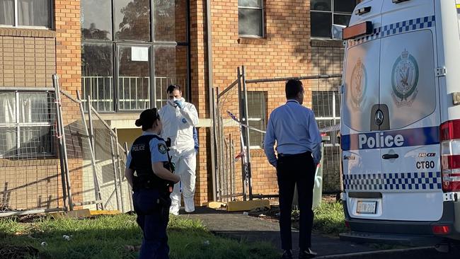 Police investigators at a crime scene on Middleton Rd, Leumeah after a body was found inside. Picture: Annie Lewis