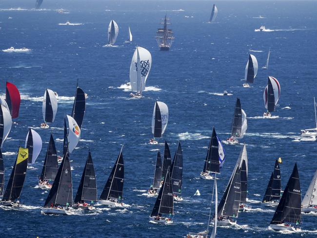 Yachts compete during the start of the annual Sydney to Hobart yacht race on Boxing Day at Sydney Harbour on December 26, 2024. (Photo by David GRAY / AFP) / -- IMAGE RESTRICTED TO EDITORIAL USE - STRICTLY NO COMMERCIAL USE --