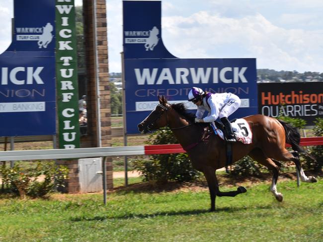 Sir Bam coasts to the line for rider Grace Willoughby and Toowoomba trainer Tom Dougall in the fourth race on the card at Allman Park.