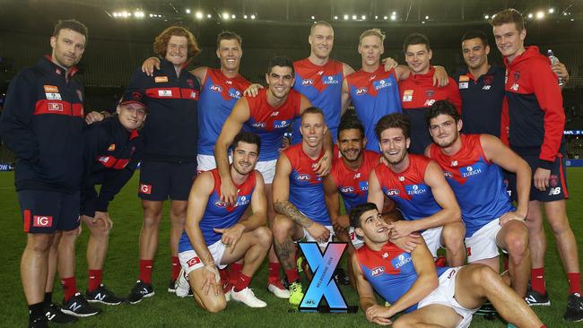 Victorious coach Craig Jennings (left) with Melbourne’s AFLX premiership team. Picture: Michael Klein