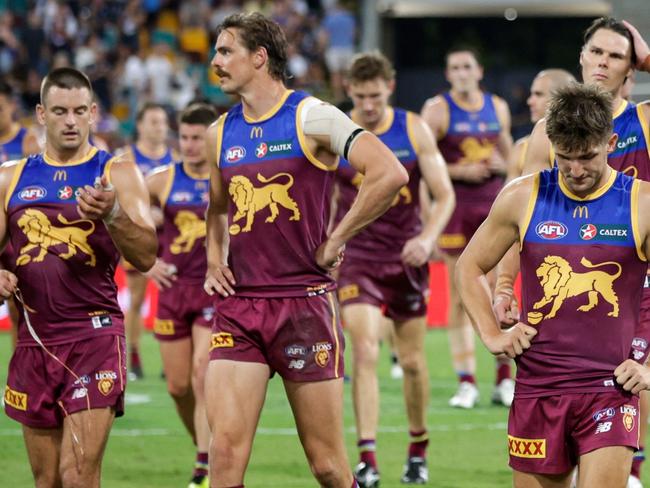 BRISBANE, AUSTRALIA - MARCH 08: Brisbane Lions are seen leaving the field after the 2024 AFL Opening Round match between the Brisbane Lions and the Carlton Blues at The Gabba on March 08, 2024 in Brisbane, Australia. (Photo by Russell Freeman/AFL Photos via Getty Images)