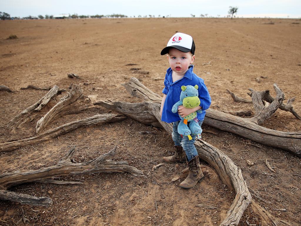 Finn Holcombe, 2, on his family’s dry land near Walgett. Picture: Sam Ruttyn