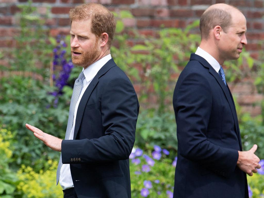 Britain's Prince Harry, Duke of Sussex (L) and Britain's Prince William, Duke of Cambridge attend the unveiling of a statue of their mother, Princess Diana at The Sunken Garden in Kensington Palace.