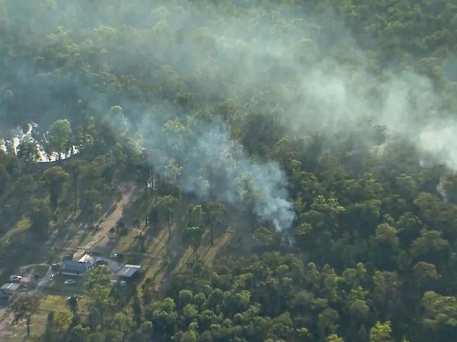 Smoke rises from the property in the aftermath of the shooting. Picture: Nine News