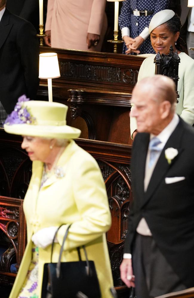 Meghan Markle's mother Doria Ragland (back) watches as the Queen and Prince Phillip arrive for her daughter’s wedding. Picture: AFP Photo/Dominic Lipinski