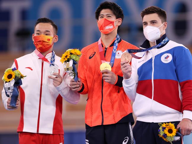 Silver medallist Ruoteng Xiao of Team China, gold medallist Daiki Hashimoto of Team Japan and bronze medallist Nikita Nagornyy of Team ROC pose with their medals. Picture: Laurence Griffiths/Getty Images