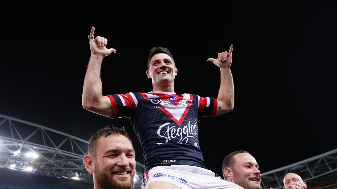 Cooper Cronk is chaired off by Roosters’ teammates after their 2019 NRL grand final win. Photo by Matt King/Getty Images