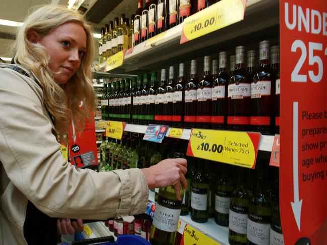 Londoner Lara Honnor buys some Aussie wines from a Tesco Metro supermarket in London, UK.