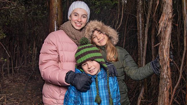 Eva Rudrup aged 12, Taj Rudrup aged 8 from Woodbridge and Emi Alexander aged 9 from Central Coast NSW were rugged up ready for a walk on Mount Wellington / kunanyi on Sunday 14th July 2024. Picture: Linda Higginson