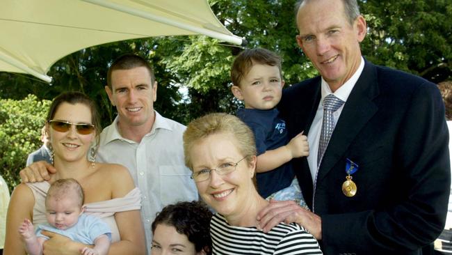 Wayne Bennett with his family, including wife Trish (front right).