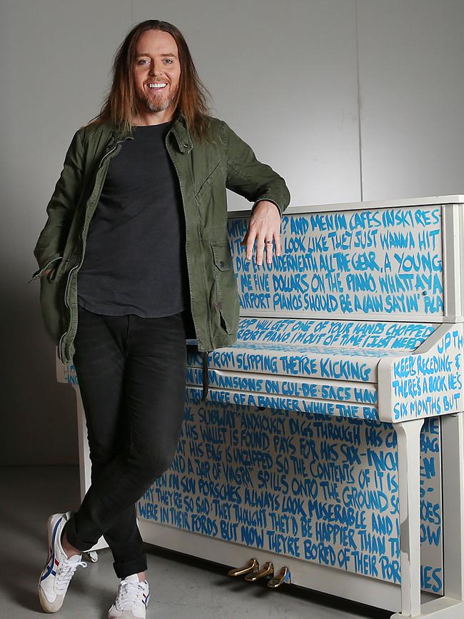 Tim Minchin with his one-of-a-kind piano. Picture: Jane Dempster