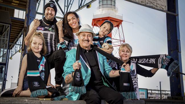 Diehard Power supporters the Catalano family are hoping to score tickets to Port’s preliminary final on Friday. Jesse Catalano, his wife Lauri and their children Sebastian, 3, and Indiana, 6, are cheering with Jesse’s parents Nick and Sonia Catalano at Port Adelaide. Picture: Mike Burton