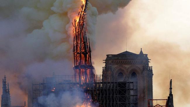 The spire at Notre Dame collapses.