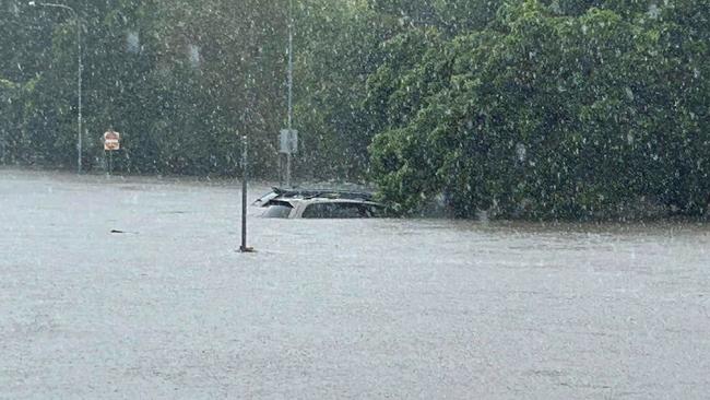 A car underwater in Gladys Street, Stones Corner.