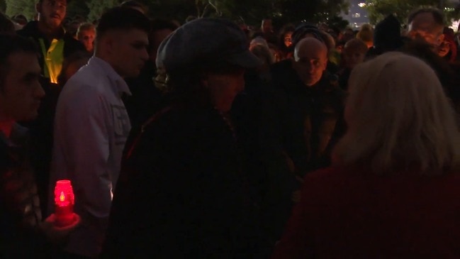 Vigil for Courtney Herron in Parkville sees hundreds of mourners on a wet Melbourne night