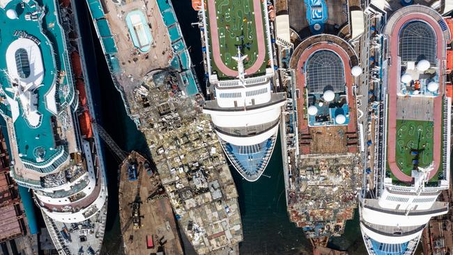 Luxury cruise ships are seen being broken down for scrap metal at the Aliaga ship recycling port in October in Izmir, Turkey. Picture: Getty