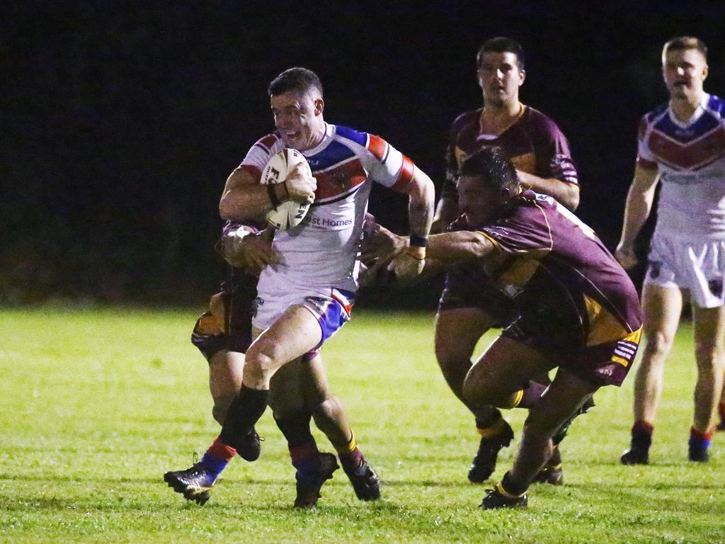 Knights Dallas Skardon breaks through the Cockatoos' defence in the Cairns and District Rugby League (CDRL) match between the Ivanhoe Knights and the Southern Suburbs Cockatoos, held at Smithfield. Picture: Brendan Radke