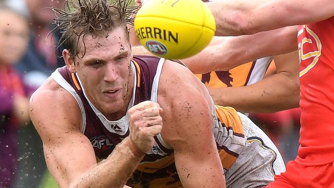 BRISBANE, AUSTRALIA - MARCH 11:  Tom Bell of the Lions gets a handball away during the JLT Community Series AFL match between the Gold Coast Suns and the Brisbane Lions at Fankhauser Reserve on March 11, 2018 in Brisbane, Australia.  (Photo by Bradley Kanaris/Getty Images)