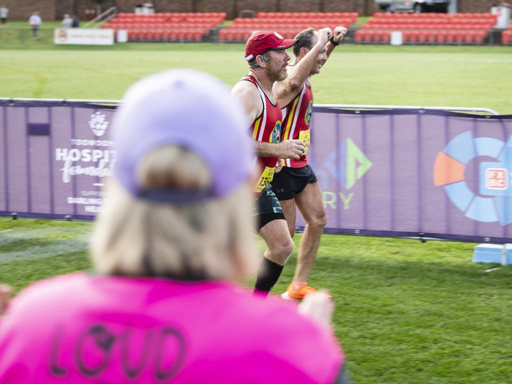 Toowoomba Road Runners members are cheered on as they finish the half marathon of the Toowoomba Marathon, Sunday, May 5, 2024. Picture: Kevin Farmer