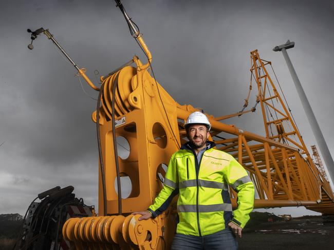 Project Director Lyndon Frearson next to the Tower Crane during the Granville Harbour Wind Farm construction. Picture: CHRIS KIDD