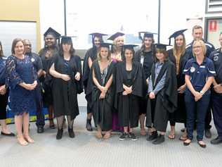 BOOYAH GRADS: Charlie Jenson (CQU), Sam Cowie (Education QLD), Randall Warkill (Police Liaison Officer), Latajah Von-Sendon , Antoinette Theideke, Jamilla Ahern, Kyna Tynan, Crystal Hogarth, Shelby Kiernan, Alexis Henderson, Vanessa Morrison, Mikayla Nolan, Bill Cullen (Youth Support Officer), Clare Warrington (Youth Support Officer) and Joe Ramsay (Coordinator). Picture: Jann Houley