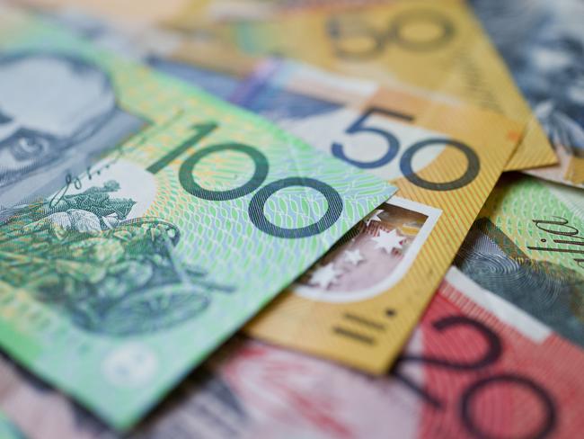 Australian money background showing $100, $50 and $20 notes with a shallow depth of field.