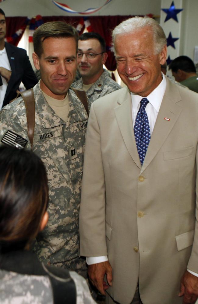 Former US Vice President Joe Biden, right, with his son, US Army Capt. Beau Biden, at Camp Victory on the outskirts of Baghdad, Iraq, on July 4, 2009. Picture: Khalid Mohammed