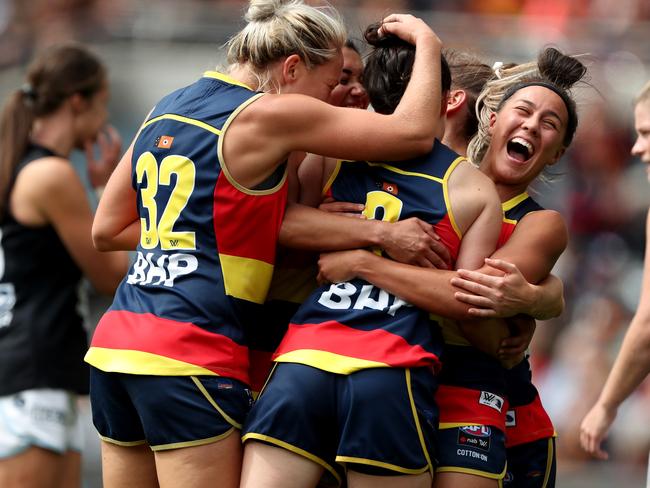 Crows players celebrate an Eloise Jones goal during the 2019 AFLW Grand Final match between Adelaide and Carlton at Adelaide Oval in front of 53,034 people. Picture: James Elsby/AFL Photos/Getty Images