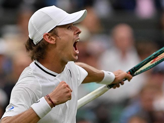 Australia's Alex De Minaur celebrates winning a point against France's Arthur Fils during their men's singles fourth round tennis match on the eighth day of the 2024 Wimbledon Championships at The All England Lawn Tennis and Croquet Club in Wimbledon, southwest London, on July 8, 2024. De Minaur won the match 6-2, 6-4, 4-6, 6-3. (Photo by Glyn KIRK / AFP) / RESTRICTED TO EDITORIAL USE