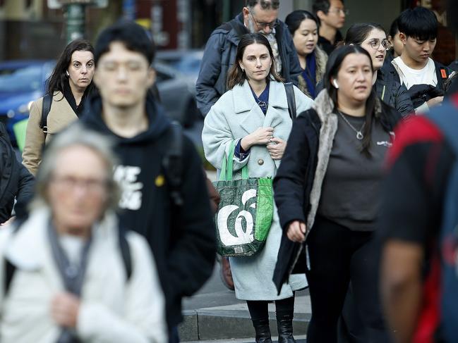 SYDNEY, AUSTRALIA - NewsWire Photos JULY 17, 2024:  Pedestrians crossing Elizabeth street   in the Sydney CBD. The Australian Bureau of Statistics, (ABS) releases it's latest job figures tomorrow.  Picture: NewsWire / John Appleyard