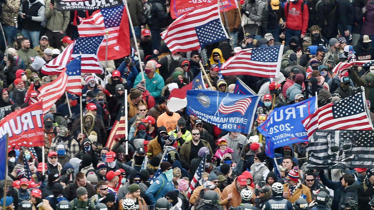 Trump supporters clash with police and security forces as they storm the US Capitol in Washington, DC in November 2020. Picture: AFP